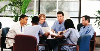 A group of medical professionals meeting together